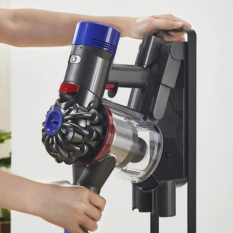 Person mounting Dyson V6 on Must Have Docking Station Replacement Wall Mount Bracket For Dyson V6 Series Vacuums Compatible DC58 DC59