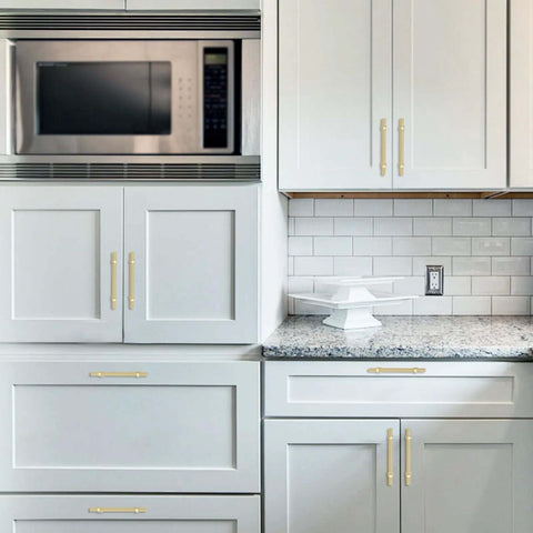 Top Shelf Brushed Gold Kitchen Cabinet Handles Five Inch Pulls Straight Up Premium Zinc Alloy Hardware on white kitchen cabinets.