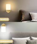 Frosted Wall Sconce Set Of Two In Brushed Gold Modern Sleek Brass Vanity Lights for Bedroom, shown illuminating up and downwards.