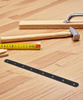 Heavy Duty Stainless Steel Black Flat Angle Brackets for Furniture Repair on a wooden surface with tools