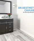 Bathroom vanity on white washed laminate floor featuring self adhesive vinyl floor transition strip for laminate and tile floors.
