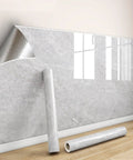 Premium Waterproof Marble Peel And Stick Wallpaper Slick Self Adhesive Decor Rolls on wall, showing adhesive layer and roll.