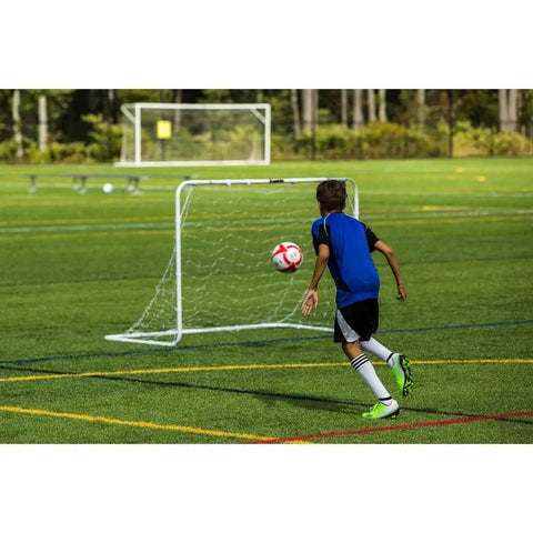 Easy Set Soccer Goal 6 Foot By 4 Foot Portable Backyard Frame With No Tools Needed Rust Resistant Steel Construction Snap Together Poles And Self Stick Net Straps For Quick Setup For Practice And Games used by boy on field