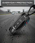 Premium Slick Porsche Key Fob Cover on racetrack getting scratched, emphasizing durability and scratch protection.