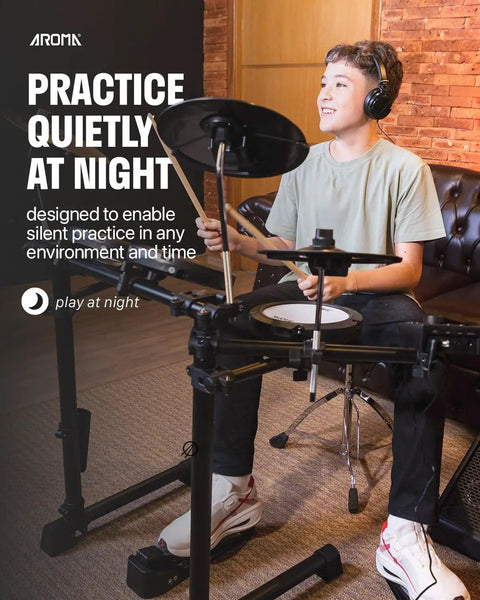 Teen playing Electronic Drum Set With 4 Quiet Mesh Pads And 2 Pedals Portable Solid Build Bluetooth Ready indoors at night