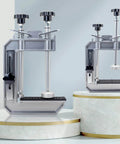45 Degree Stone Mitre Clamp For Countertop Seam Splicing displayed on marble platforms