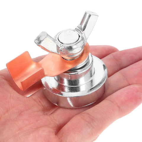 Heavy Duty Magnetic Welding Ground Clamp For Fast Attachment On Metal Rods Posts Railings And Tables held in hand, silver iron build.