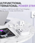 All In One International Power Strip With USB C And Four USB Ports EU UK US Plug Adapter on marble table with devices charging