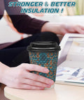 Hella Sturdy Double Wall Paper Coffee Cups With Leak Proof Lids 100 Pack 12 Oz in hand, textured blue insulated drinkware for hot beverages.