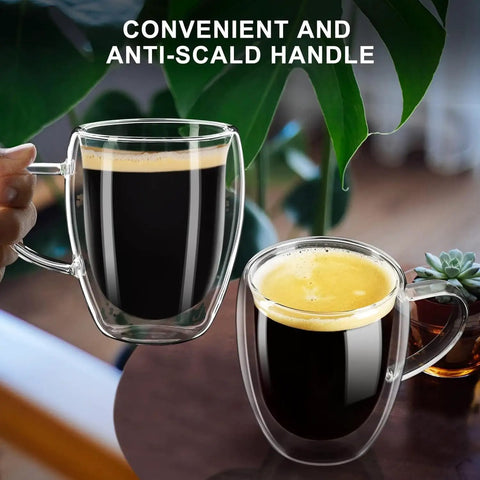 Grab These Sleek Double Wall Glass Coffee Mugs Set Of Two, Tough Borosilicate Build Keeps Your Daily Grind Straight Fire Or Icy Fresh, Ergonomic Handle Design Perfect For Kitchen Vibes And Road Trips, featuring a hand holding one mug.