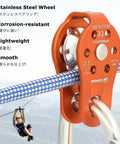 Orange zipline pulley with stainless steel bearing, attached to blue rope, for rescue, climbing, mountaineering, heavy duty aluminum alloy.