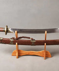Folded Steel Dao Sword With Phoenix Motif, Handmade High Carbon Blade With 32,768 Layered Steel For Superior Flex And Edge, displayed on stand