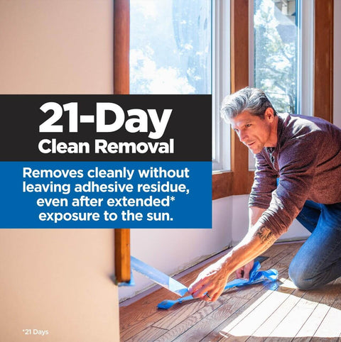 Person applying PROSharp Painter's Tape 2 in (1.88 in x 60 yd) 1 Roll Blue Edge-Lock+ on indoor baseboard, highlighting clean removal.
