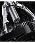 Beefy 10 Ton To 20 Ton Hydraulic Three Jaw Bearing Puller With Integrated Lateral Split Arms close-up of gripping claws on a gear.