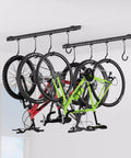 Ceiling Mounted Bike Rack for Garage Heavy Duty Indoor Metal Bike Hanger With 8 Adjustable Hooks That Holds Four To Eight Bikes Space Saving Ceiling Storage for Bikes in Garage or Basement 2 Piece Set, shown holding four bikes.