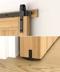 Close-up of Six Point Six Feet Long Sliding Barn Door Hardware Kit For Single Door Sturdy Durable Carbon Steel With Black Coating To Prevent Rust Heavy Duty Easy To Install Fits Thirty Six To Forty Inch Wide Doors J Shape Hanger Included on wooden door.