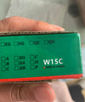 Close-up of HGW15 linear guide rail packaging with identifiable product codes, held in hand.