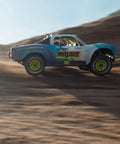 Grom 4x4 Desert RC Truck Ready To Run With Battery And Charger Included 2S LiPo Smart Charger All Terrain, side view in desert