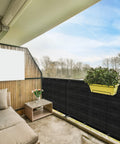 Privacy Fence Screen 3 Feet By 50 Feet Heavy Duty HDPE Mesh Shade Cover for balcony with plants and furniture