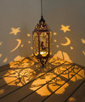 12.4 Inch Solar Outdoor Lanterns Waterproof Garden Lights With Moon And Star Cutouts, red copper lantern glowing on table