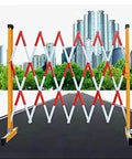 No Fuss Heavy Duty Rolling Scissor Barricade, Expanding Safety Fence Gate With Easy Roll Stoppers, Tough Portable Traffic Control Barrier on a road.