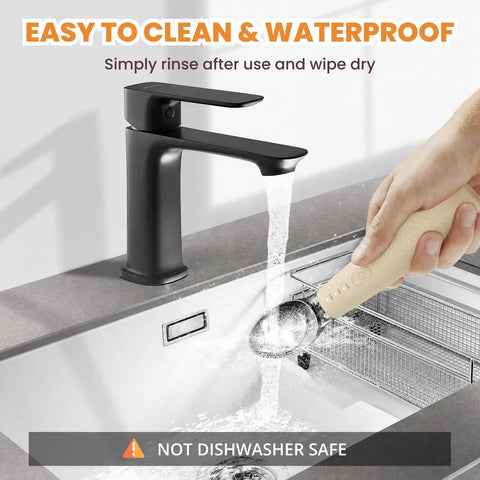 Heated Ice Cream Scoop With Three Heat Settings And 2600mAh Rechargeable Battery being rinsed under a faucet