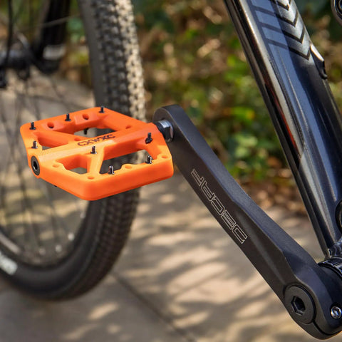 Ultra Lightweight Mountain Bike Pedals With Grippy Traction For Trail And BMX Rides Platform Pedals Nine Sixteenth Inch Axle Nylon Fiber Build Durable And Lightweight Orange installed on bike