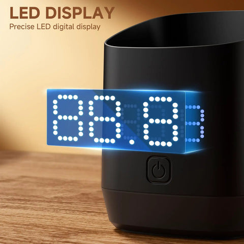 Close-up of Pro Grade Ultra Precise 0.1g Coffee Scale With Dosing Cup showing LED display on wooden surface.