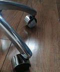 Close-up of Heavy Duty Replacement Office Chair Casters Set Of 5 Swivel Wheels With 2 Inch Diameter And 10X16MM Stem on wood floor.