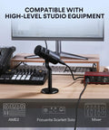 XLR Dynamic Podcast Microphone With Cardioid Pickup, Built In Double Layer Pop Filter on a desk with studio equipment