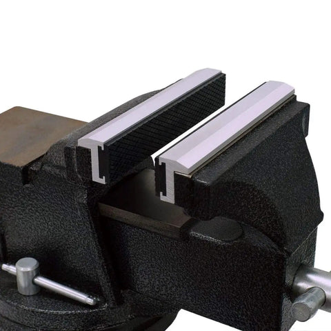 Pair Of Dead Nuts Secure 4 Inch Magnetic Soft Vise Jaw Pads on bench vice, featuring heavy duty aluminum base and soft grip pads.