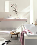 Modern bathroom with Cosmopolitan Centerset Bathroom Faucet With SilkMove Handle Starlight Finish EcoJoy, towel and decor.