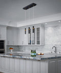 Three Light Dimmable LED Pendant Light Fixture In Modern Black With Bubble Crystal Orbs, Hanging Over Kitchen Island