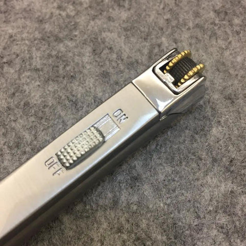 Close-up of Windproof Jet Torch Lighter With Locking Flame Viewable Flame Butane Cigar And Cigarette Lighter silver metal switch.