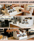 Two Tier Wooden Coffee Bar Organizer For Countertop With Dust Proof Drawer And Five Compartments For Syrups Pods Tea Bags And Cups White Finish Coffee Station Accessories Holder Must Have in kitchen setting