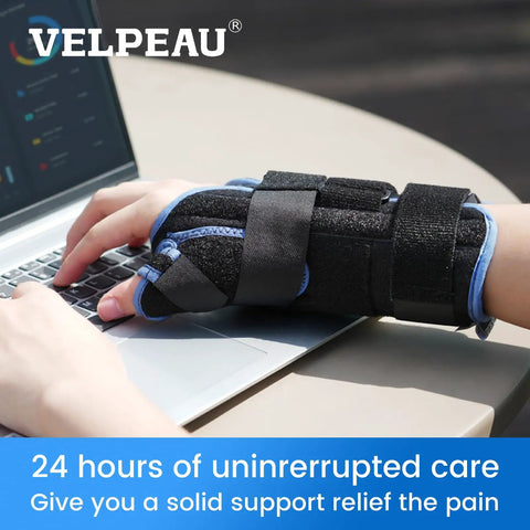 Carpal Tunnel Wrist Brace With Thumb Stabilizer for Night Support and All Day Comfort on left hand typing on laptop