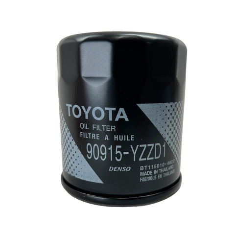 Close-up of Toyota oil filter with 90915-YZZD1 marking, part of Oil Filter Kit 90915-YZZD1 With 90430-12031 for Toyota Vehicles.