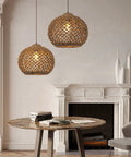 Stylish room with two One Light Rattan Woven Pendant Light Fixture With Handwoven Lampshade over round table, 13.7 inch wide.