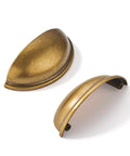 Two antique brass drawer pulls in cup design, 3-inch hole center, six pack, heavy duty zinc alloy for vintage kitchen cabinet installation.