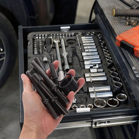 Heavy Duty Pneumatic Air Hammer Rivet Tool Kit With Stainless Steel Drill Bits And Smoothing Chisel For Tough Auto Repairs And Serious Work Jobs That Get Real Done Right. hand holding black air hammer bits over socket tray