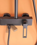 Close-up view of the Wall Mounted Exposed Shower System with Tub Spout 90° Rotating Gun Gray faucet control and hoses.