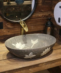 Built Tough 22 X 14 Oval Ceramic Vessel Sink Delivering Chinese Antique Charm And Easy Peasy Cleanup, set atop wooden counter.