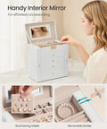 Woman using 5-Tier Jewelry Box Organizer With 4 Drawers Lockable Mirrored Case Cream White, organizing jewelry.