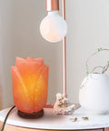 Flower Shape Pink Himalayan Salt Lamp With Wood Base And Dimmer, Handcrafted 7-8 Lbs Rock Lamp on a minimalist table.