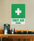 Right Arrow Green First Aid Sign 8x12 Inches Weatherproof Reflective Aluminum Plate on interior wall of a cafe.