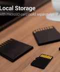 microSD cards on table highlighting local storage feature for CapsuleCam Pro Baby Monitor 4 Pack 1080p HD WiFi Indoor Security Cameras