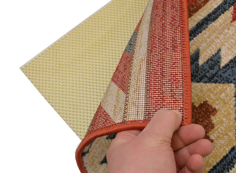 Hand lifting area rug to show Eco Friendly Non-Slip Rug Pad For Area Rugs And Runners With Extra Cushion Breathable Design underneath.
