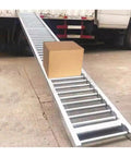 Heavy-Duty Lightweight Portable Folding Conveyor With Stainless Steel Rollers For Efficient Industrial Loading Unloading And Material Handling Projects Featuring Customizable Lengths And High Roller Density with a box moving down.