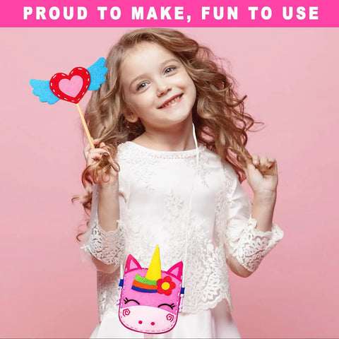 Young girl holding a heart-shaped craft from Beginner Kids Sewing Kit With 6 DIY Projects Fun Prepunched Fabric Safe Plastic Needle No Glue Arts And Crafts Toy For Girls And Boys Aged 5 To 12 Ideal Birthday Gift For Creative Little Makers, wearing unicorn-themed bag.