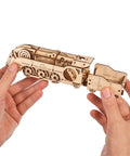 Mini Locomotive 3D Puzzle For Adults Hands On Wooden Train Model Kit Rubber Band Powered Mechanical Puzzle With 172 Pieces Easy DIY Craft Project For Home Workshop And Train Enthusiasts Pure Fun, held in hands